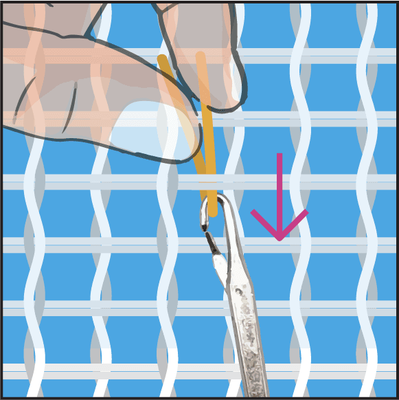 Step 2: pulling the yarn loop under the canvas threads.