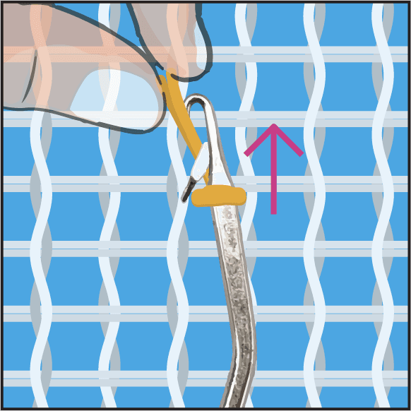 Step 3: catching both yarn ends with the latch hook.