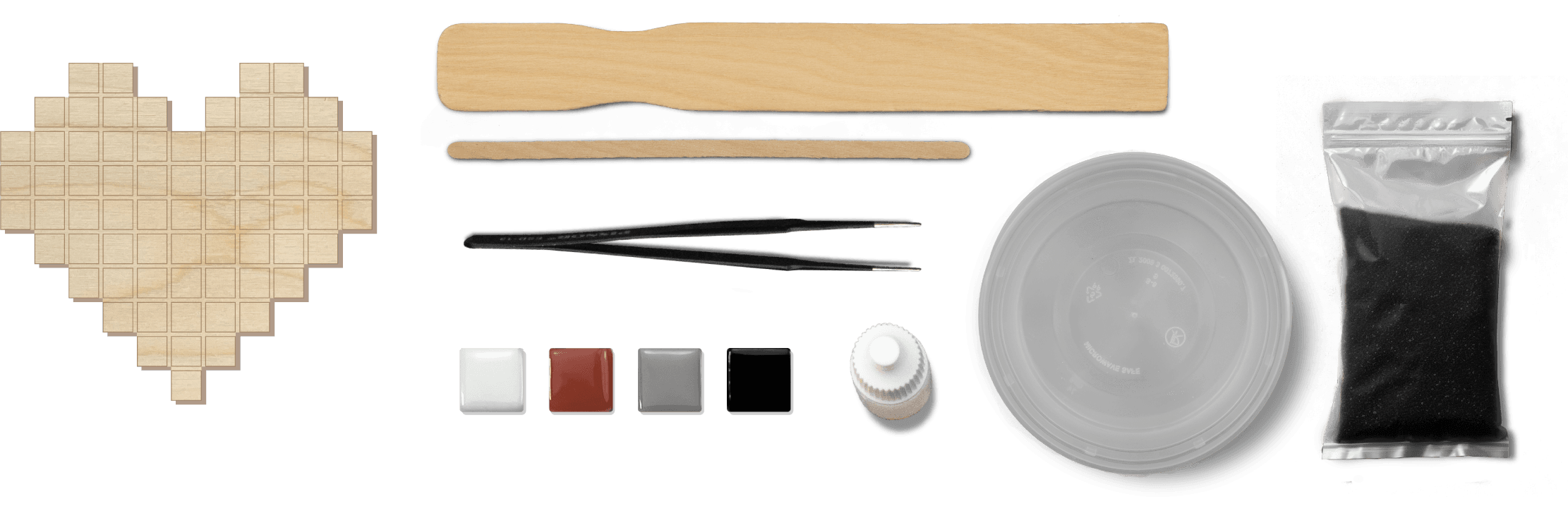 Mosaic kit tools and materials laid out in a row.